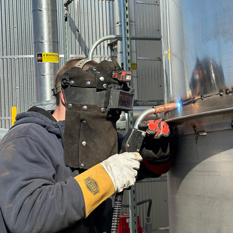 someone welding a pipe