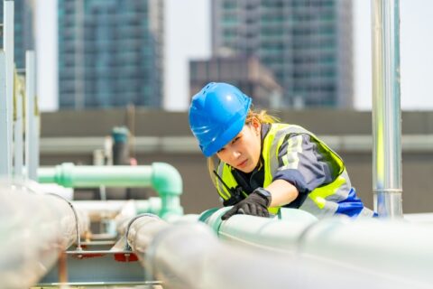 Industrial mechanical contractor working on a pipe installation in Chicago, IL